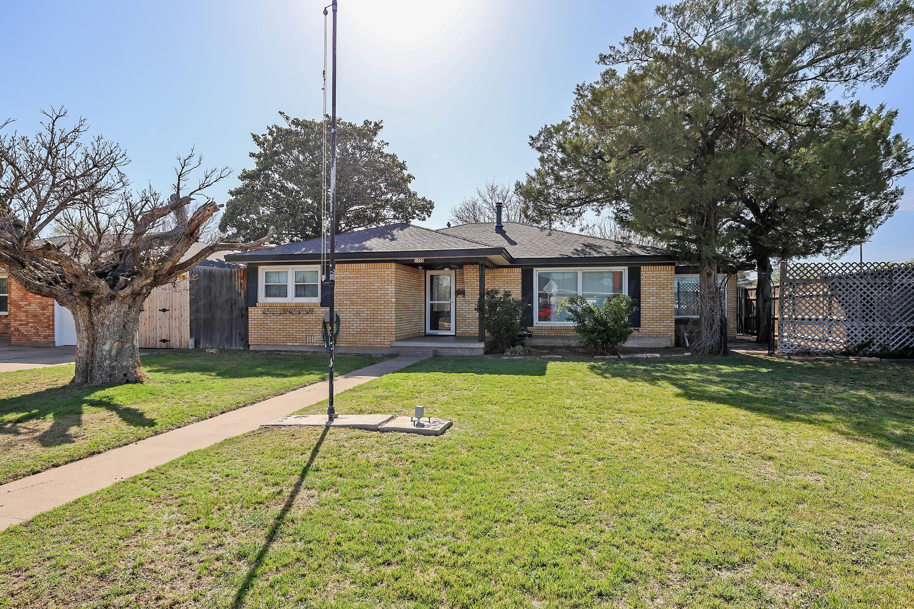 a house with swimming pool in front of it
