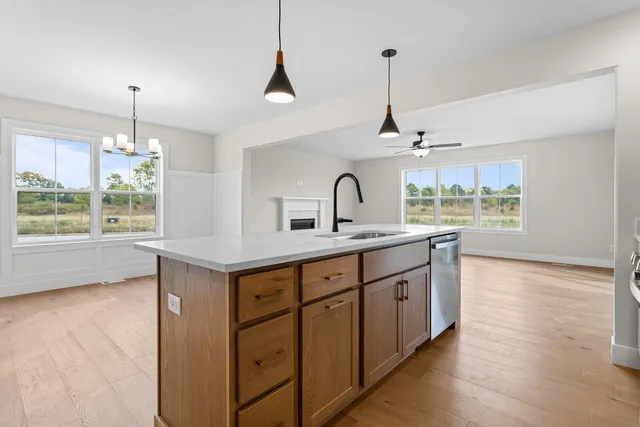 an empty room with windows and view of an empty room