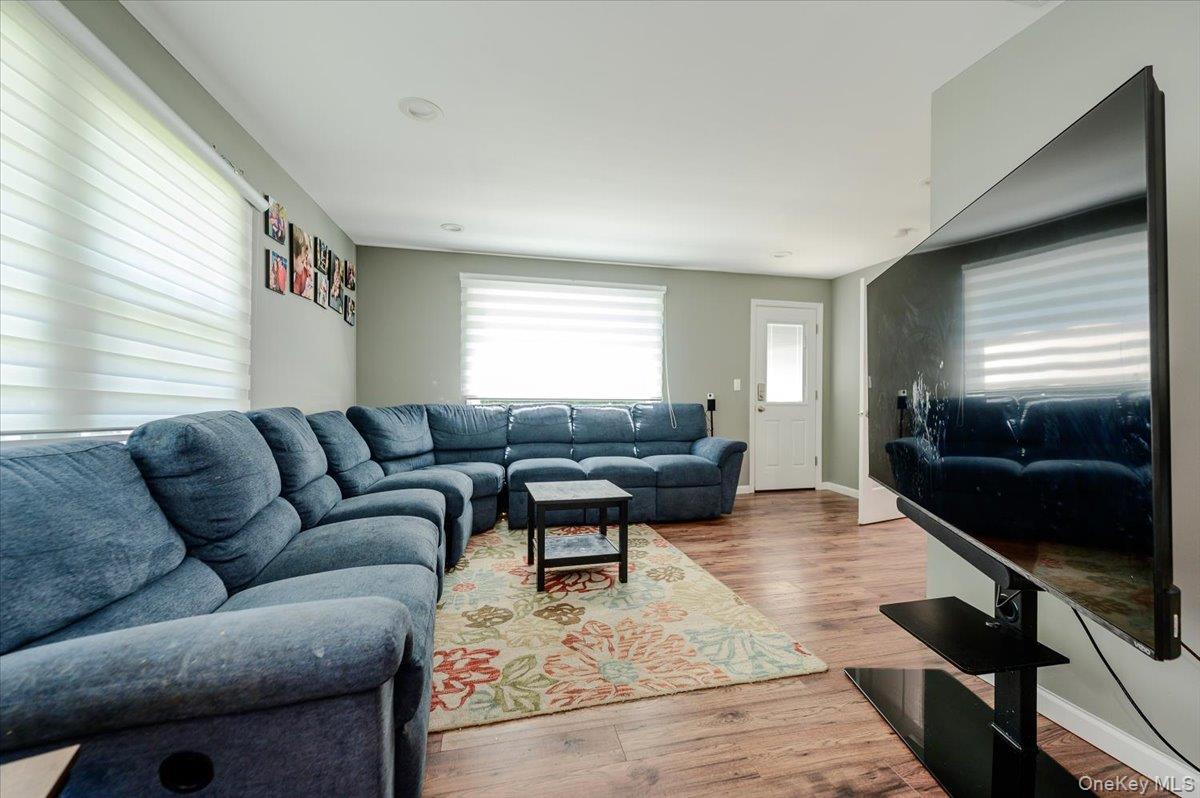 534 Allen Road Woodmere, NY 11598 - Photo 11 of 35 a living room with furniture and a flat screen tv