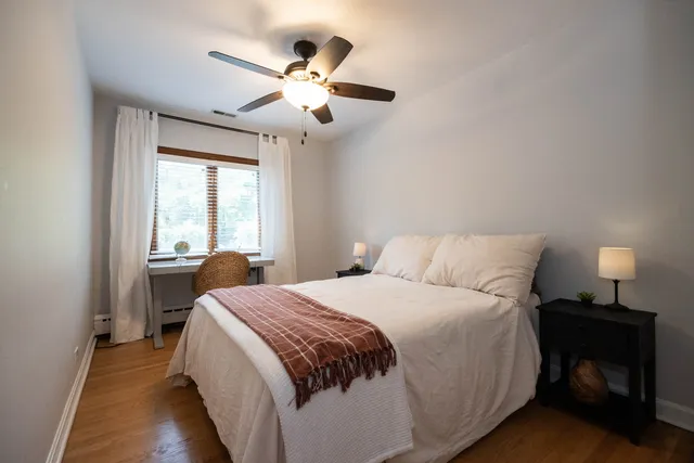 a bed room with a bed and a window