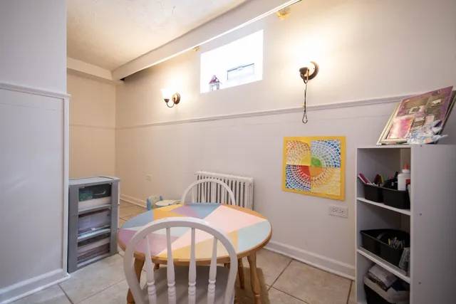 a bedroom with a bed and a book shelf