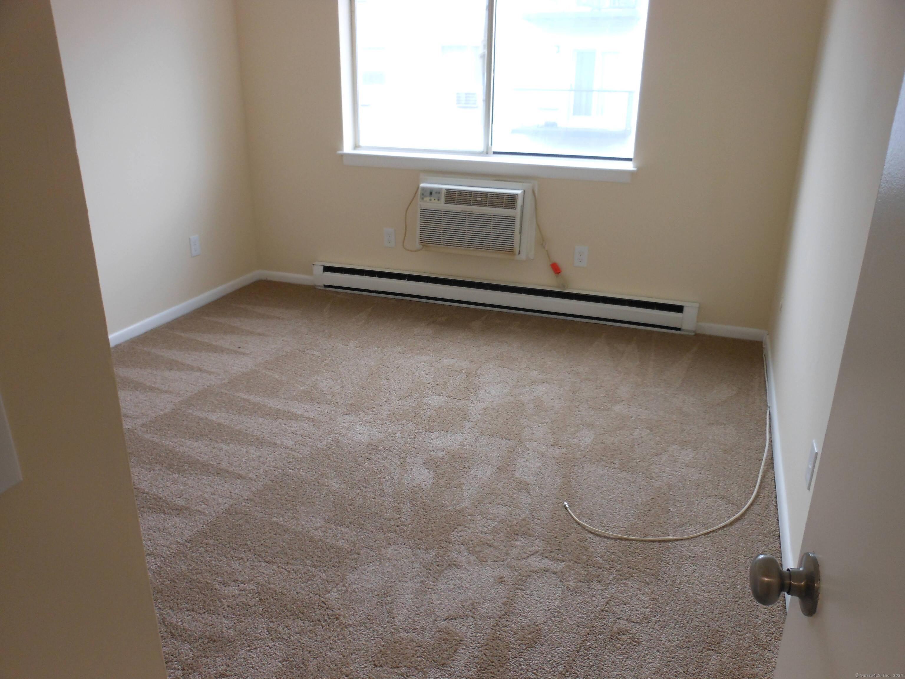 155 Short Beach Road, Unit 206 Stratford, CT 06615 - Photo 13 of 31 an empty room with a window
