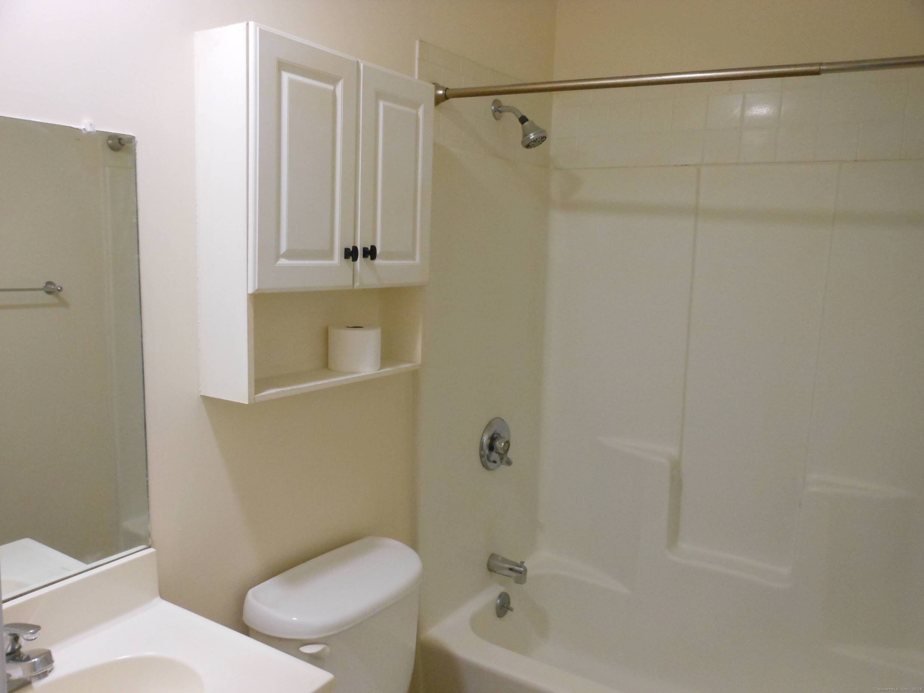 155 Short Beach Road, Unit 206 Stratford, CT 06615 - Photo 20 of 31 a bathroom with a toilet and a shower