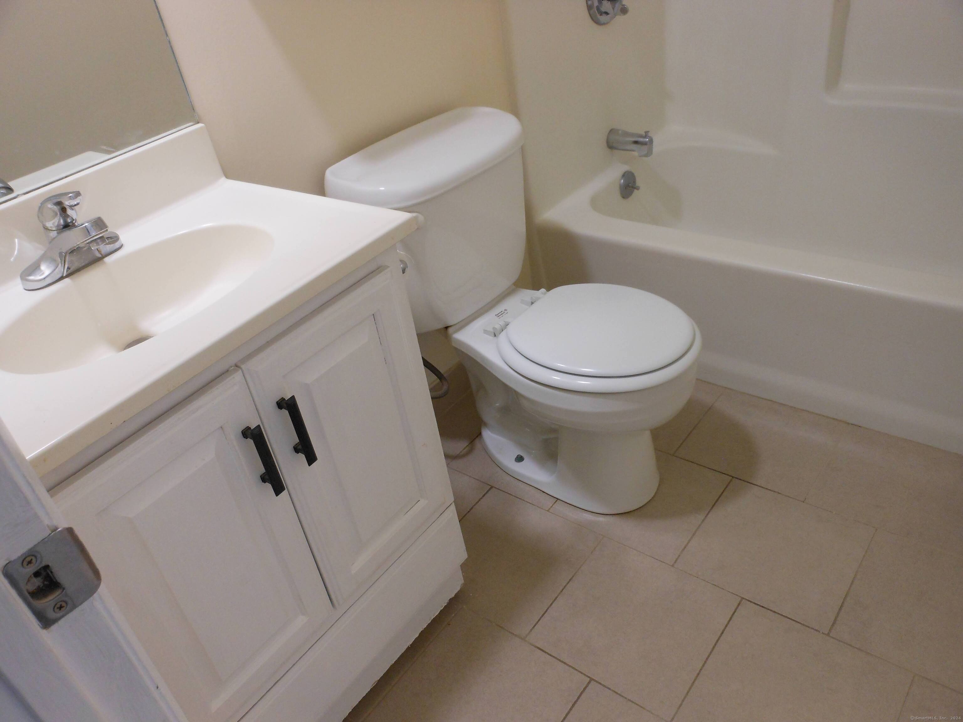155 Short Beach Road, Unit 206 Stratford, CT 06615 - Photo 21 of 31 a bathroom with a sink and toilet