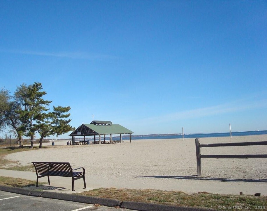 155 Short Beach Road, Unit 206 Stratford, CT 06615 - Photo 25 of 31 a view of a lake with couches in a patio