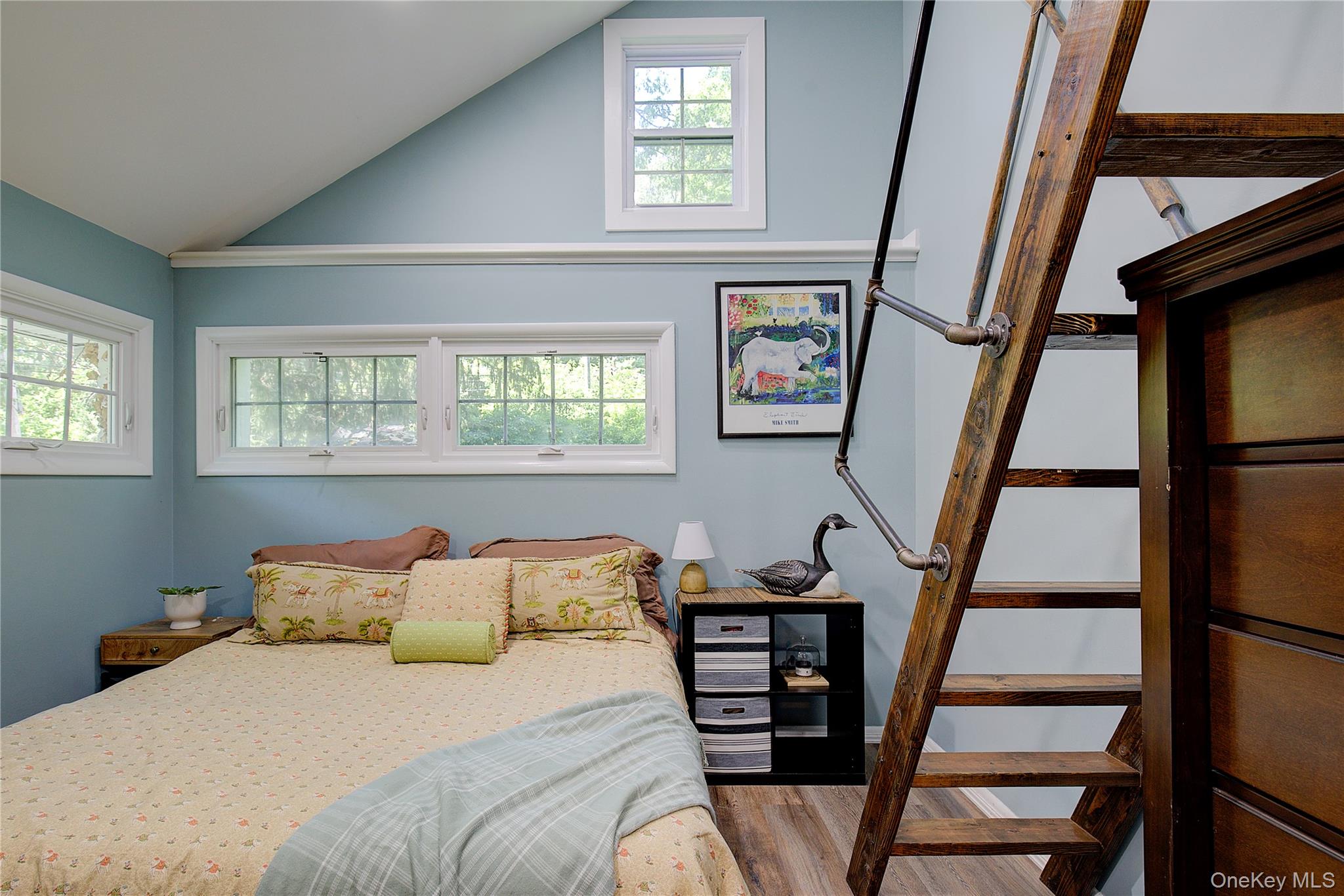 2 Spring Hollow Road Centerport, NY 11721 - Photo 17 of 44 Bedroom with vaulted ceiling and light wood-style flooring