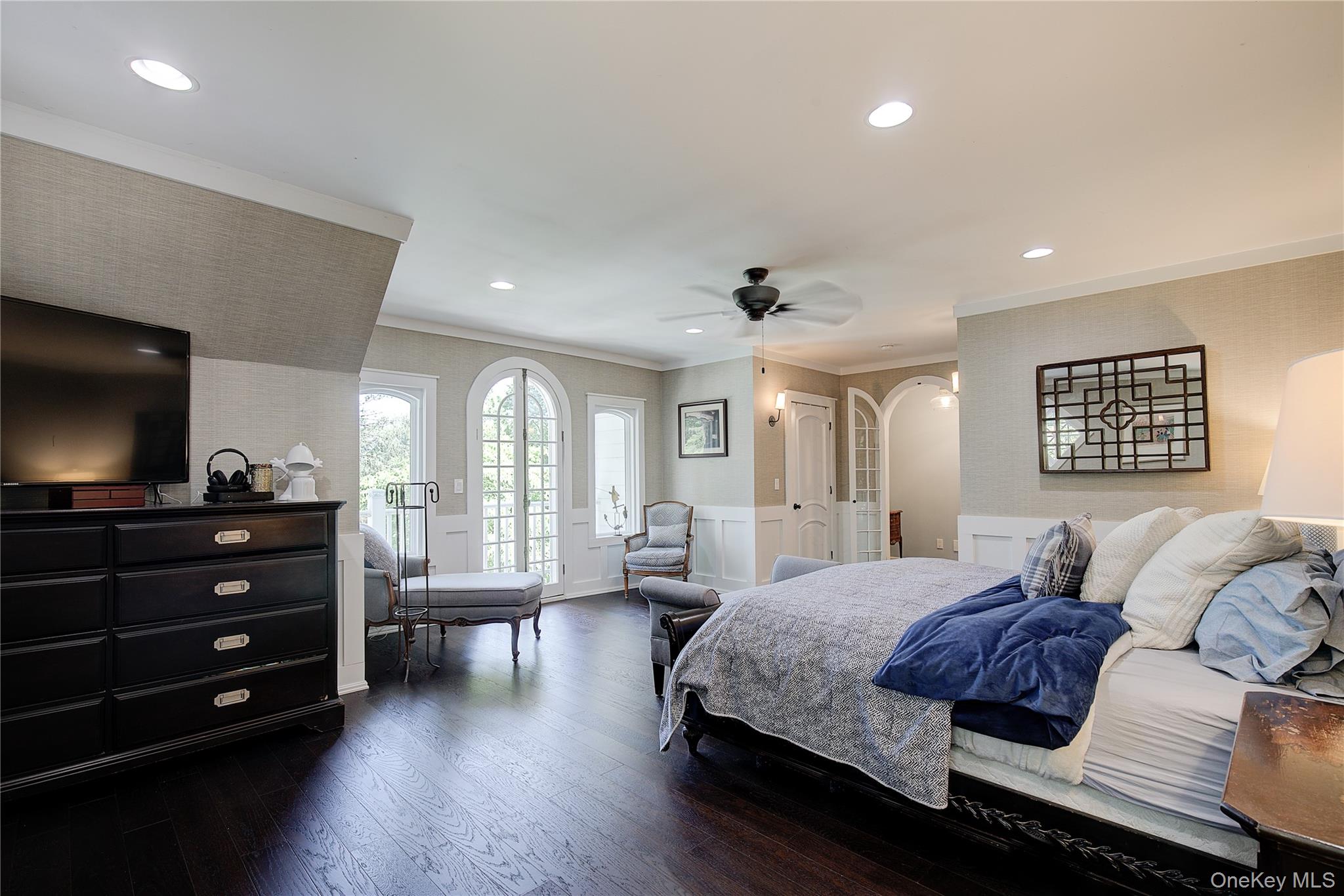 2 Spring Hollow Road Centerport, NY 11721 - Photo 23 of 44 Bedroom featuring access to exterior, dark wood-style floors, recessed lighting, wainscoting, and ceiling fan