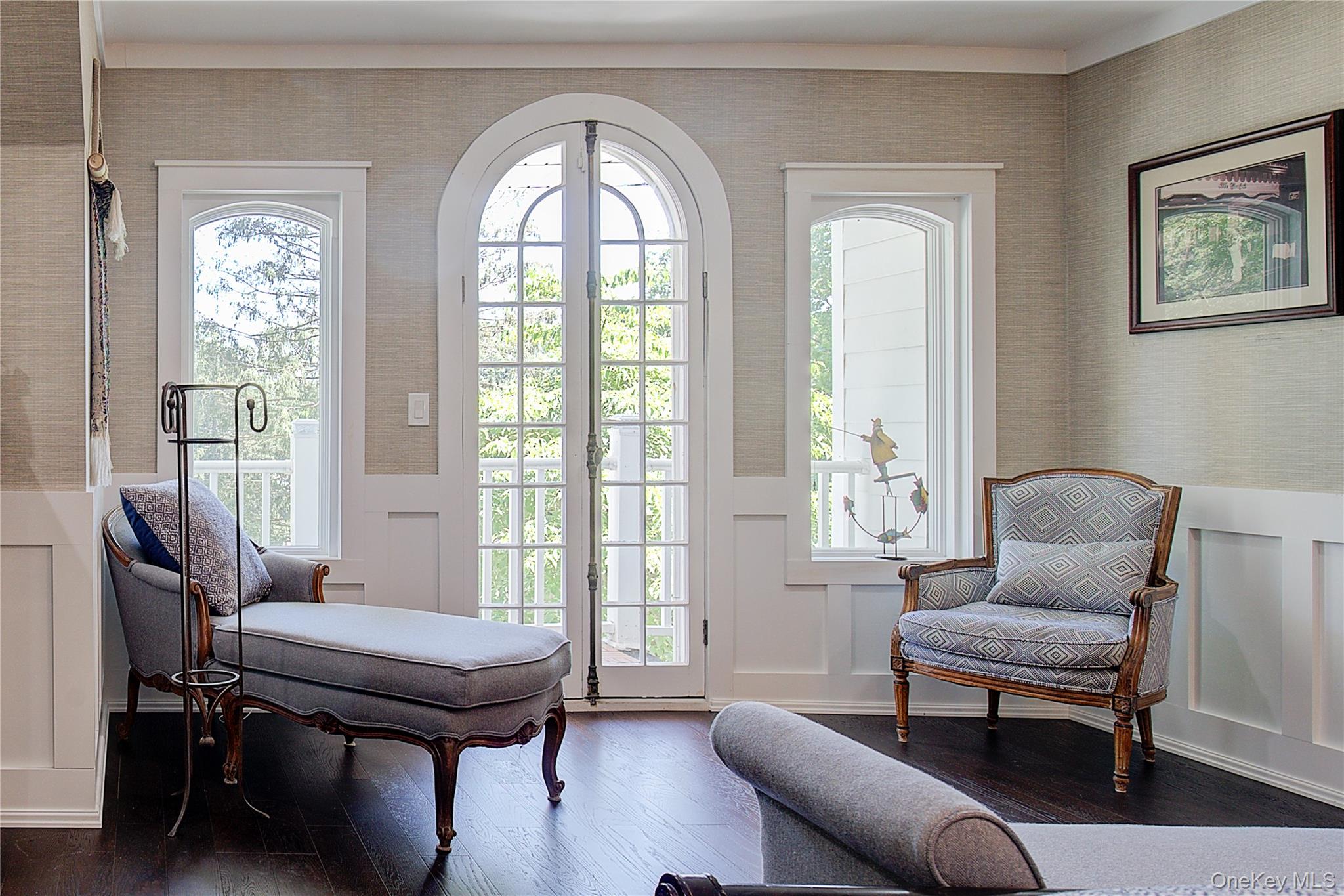 2 Spring Hollow Road Centerport, NY 11721 - Photo 24 of 44 Living area featuring wallpapered walls, wood-type flooring, a decorative wall, and a wainscoted wall