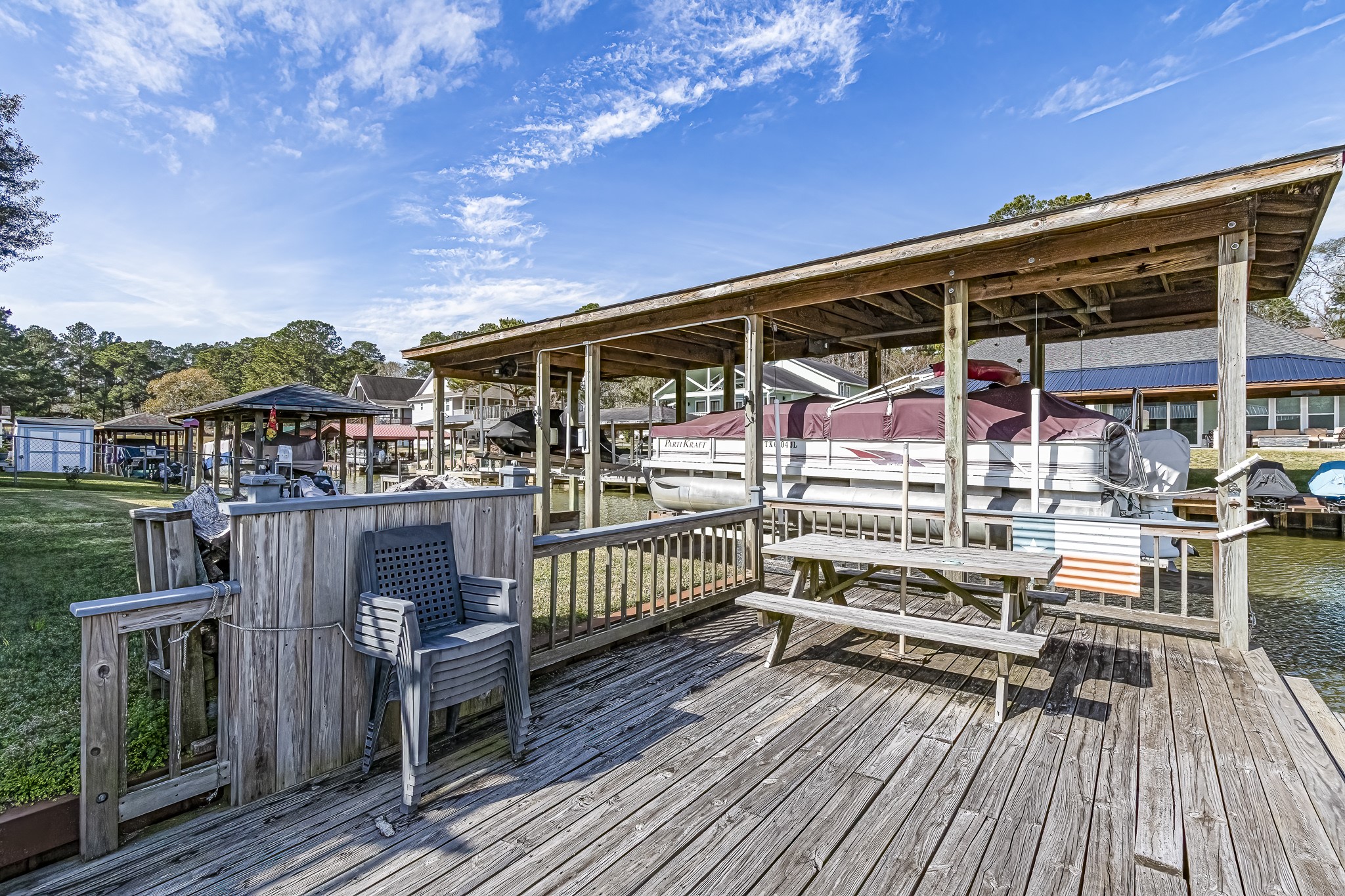 27 Marina Court Coldspring, TX 77331 - Photo 14 of 38 Relaxing primary bedroom retreat with serene natural light, ideal for unwinding after a day on the lake.