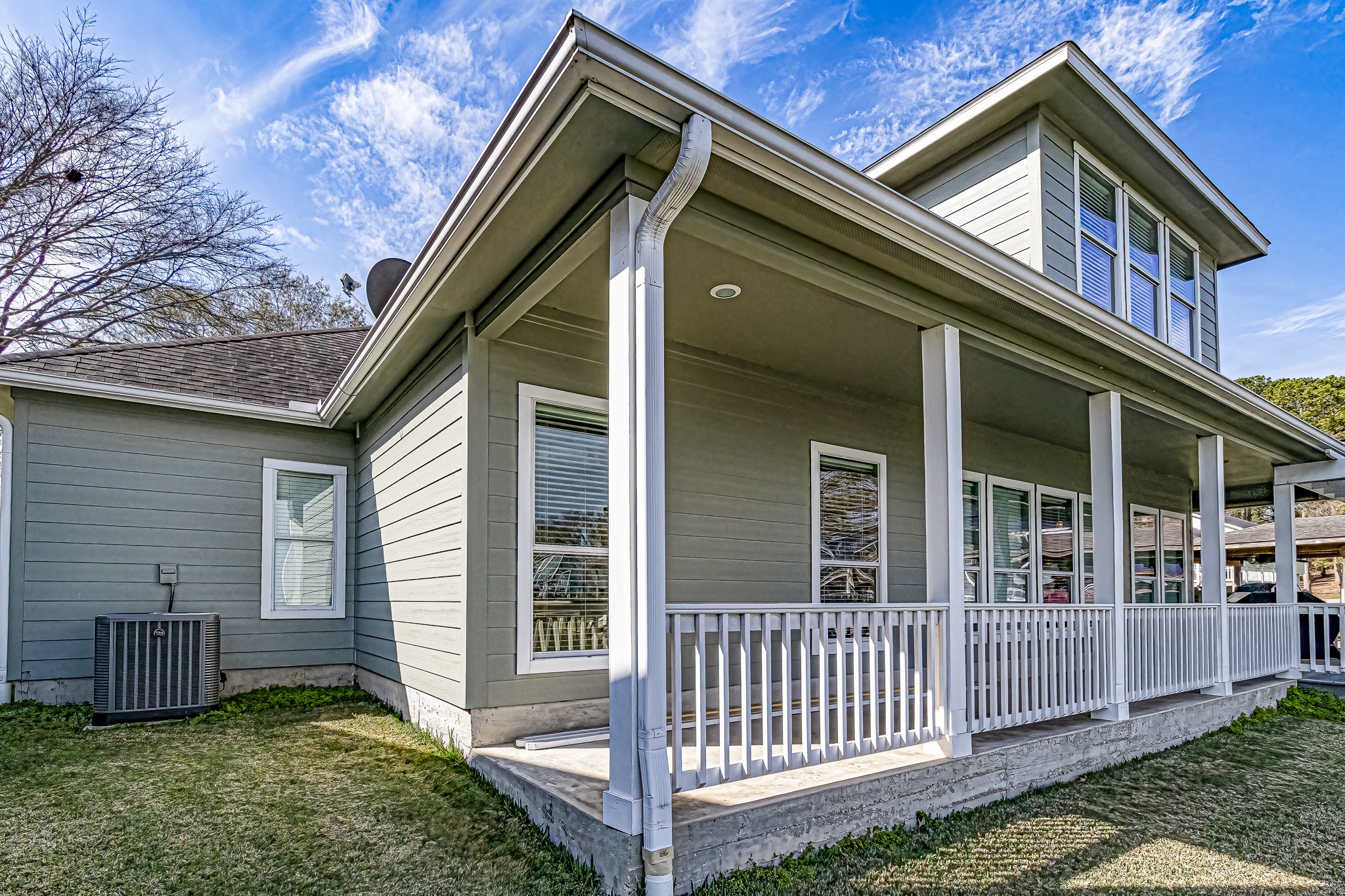 27 Marina Court Coldspring, TX 77331 - Photo 15 of 38 Wraparound covered porch designed for relaxed lake living.