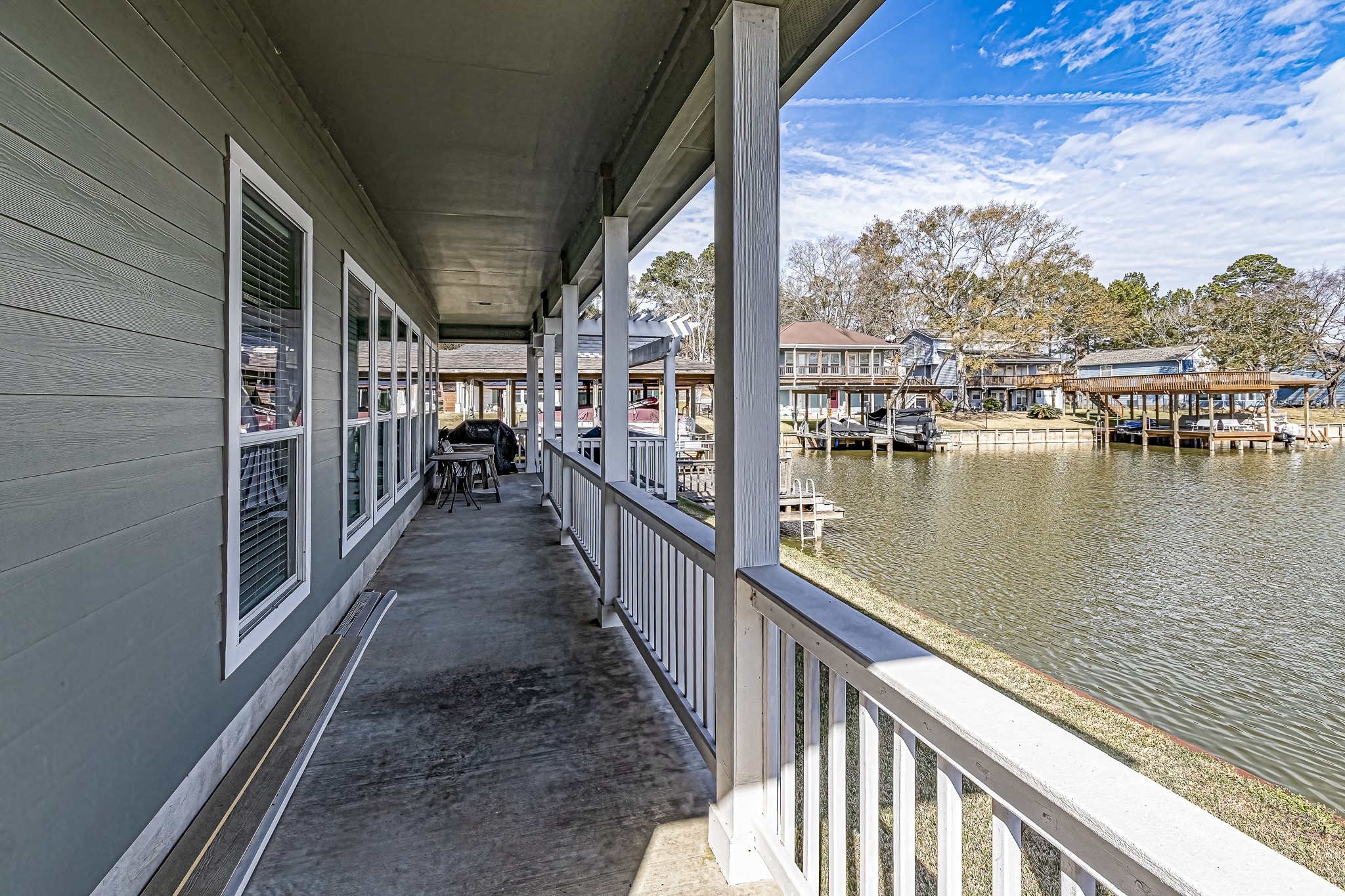 27 Marina Court Coldspring, TX 77331 - Photo 16 of 38 Inviting covered porch with timeless architectural detail.