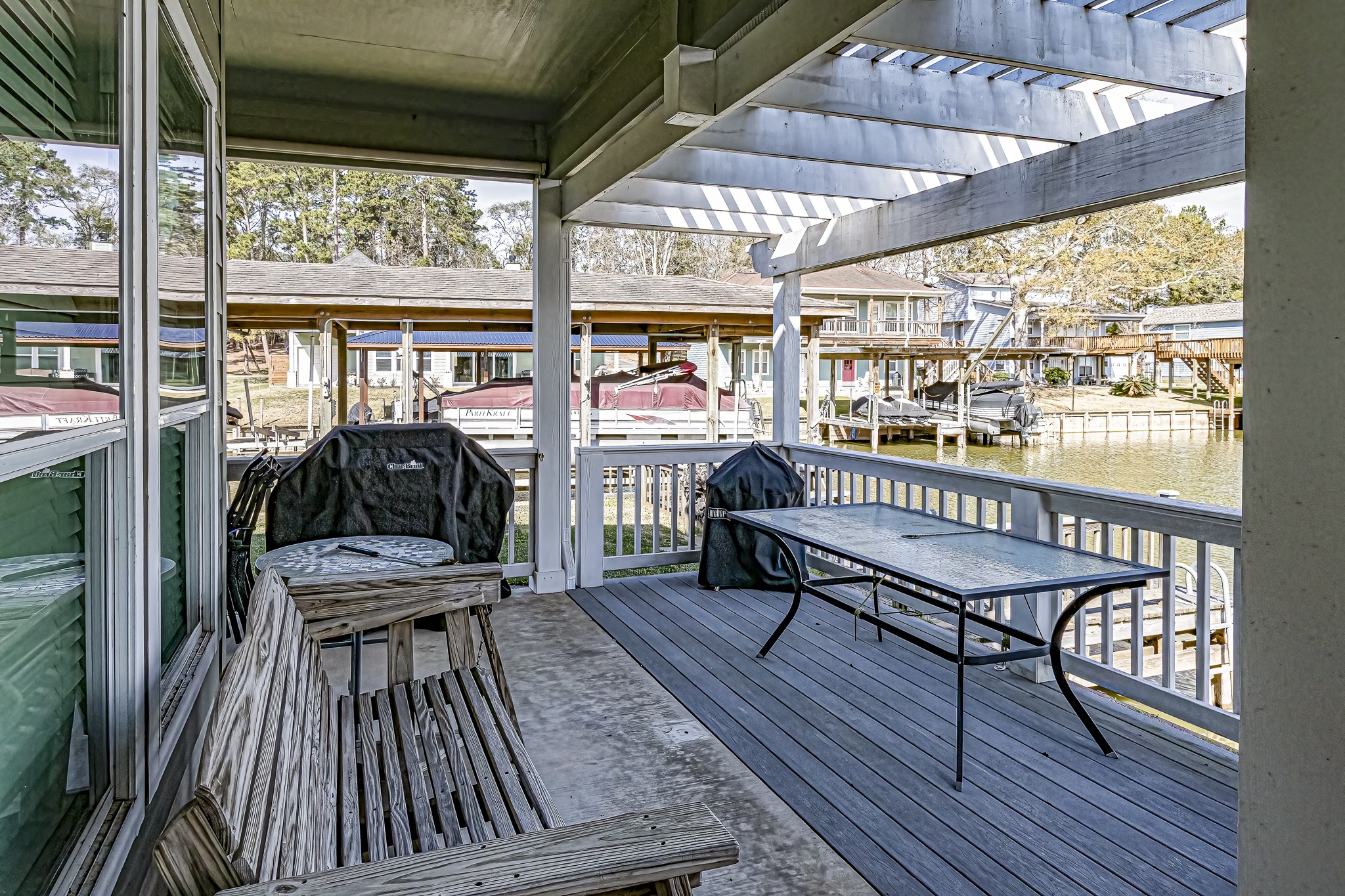 27 Marina Court Coldspring, TX 77331 - Photo 17 of 38 Covered porch perfect for morning coffee and lake breezes.