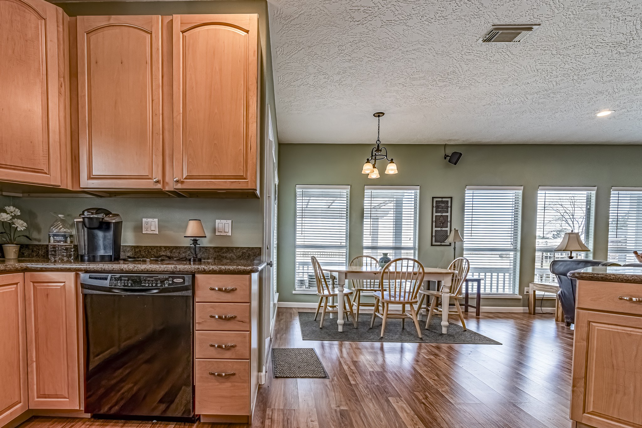 27 Marina Court Coldspring, TX 77331 - Photo 26 of 38 Open-concept kitchen flowing into dining and living areas with abundant natural light.