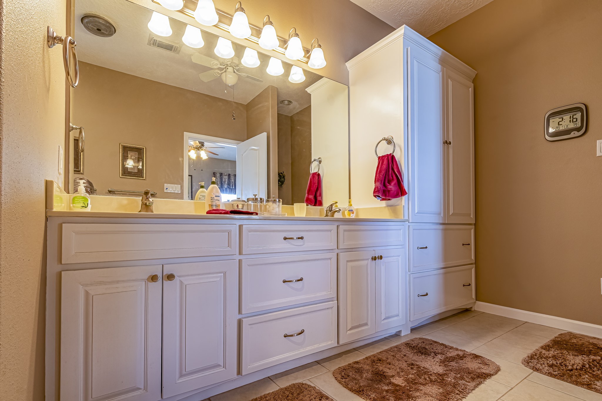 27 Marina Court Coldspring, TX 77331 - Photo 29 of 38 Primary bath with extended vanity, ample storage, and bright, inviting finishes.