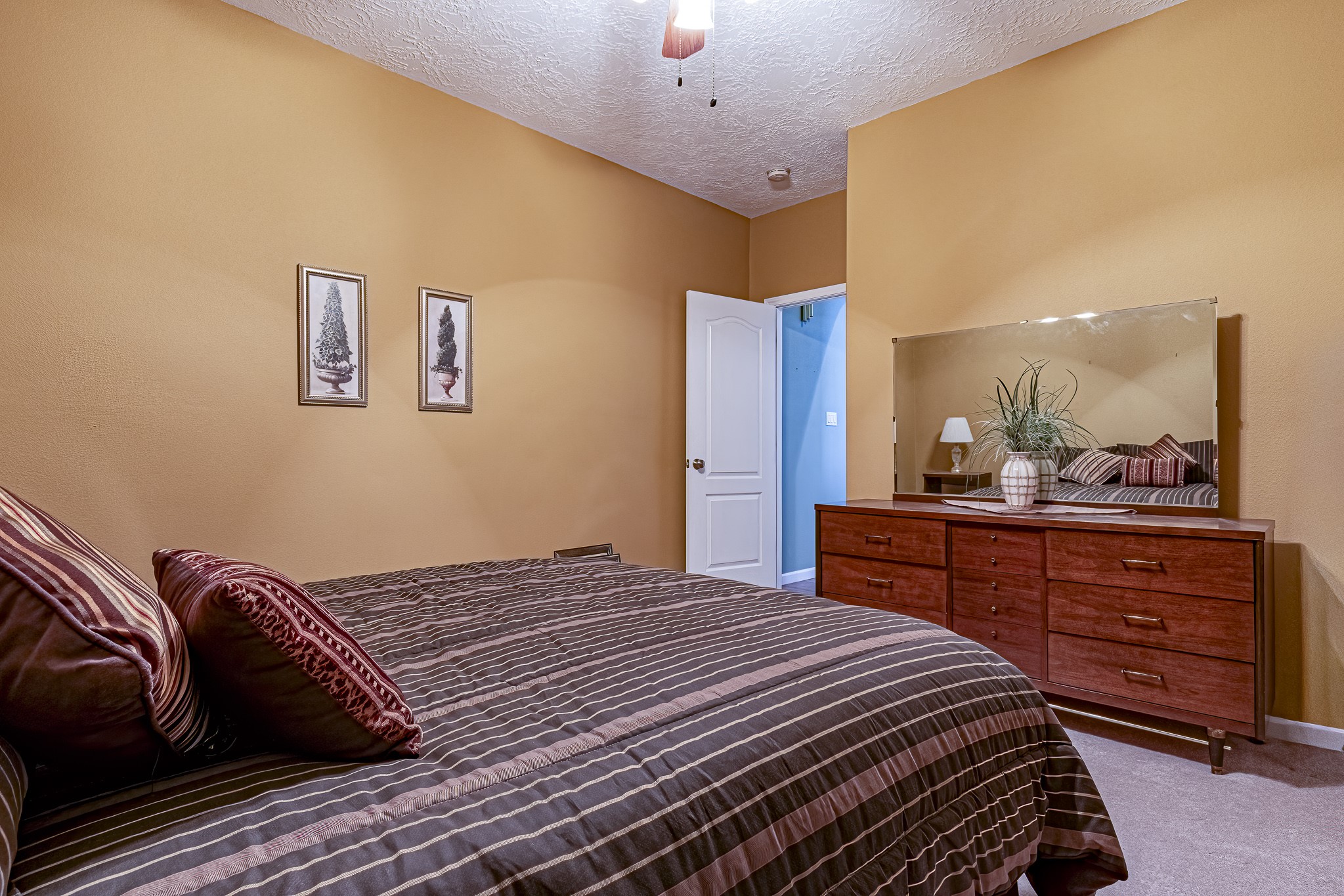 27 Marina Court Coldspring, TX 77331 - Photo 34 of 38 Inviting secondary bedroom offering ample space and a peaceful retreat.