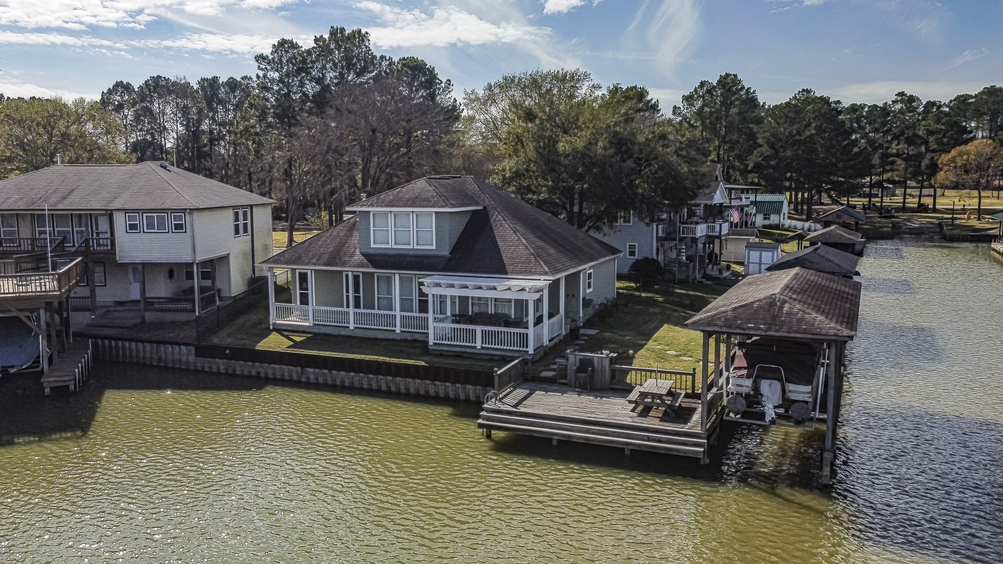 27 Marina Court Coldspring, TX 77331 - Photo 8 of 38 Peaceful waterfront community with neighboring docks and wide channels, perfect for boating and lake living.
