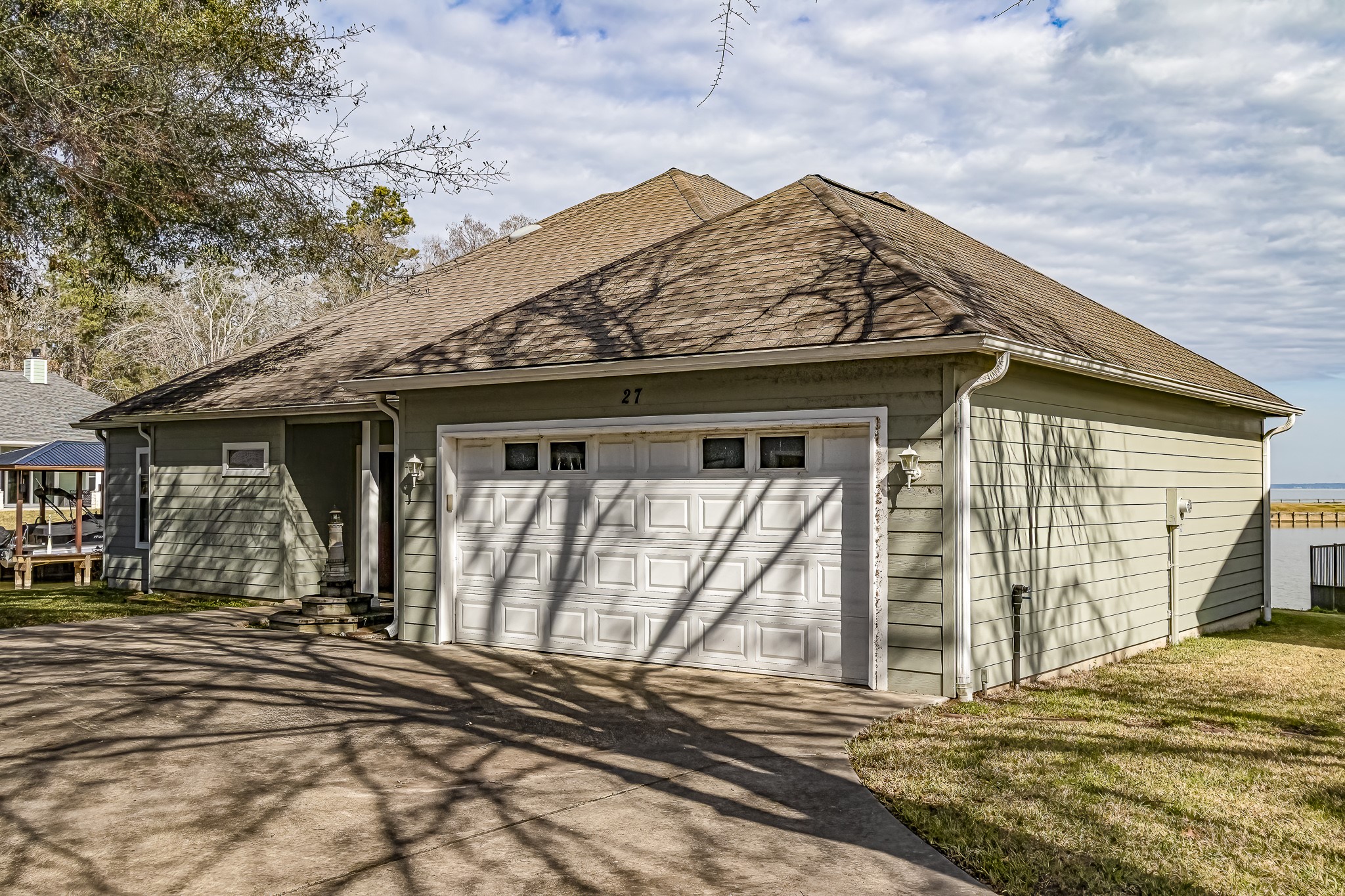 27 Marina Court Coldspring, TX 77331 - Photo 9 of 38 Inviting covered front porch adds charm and curb appeal.