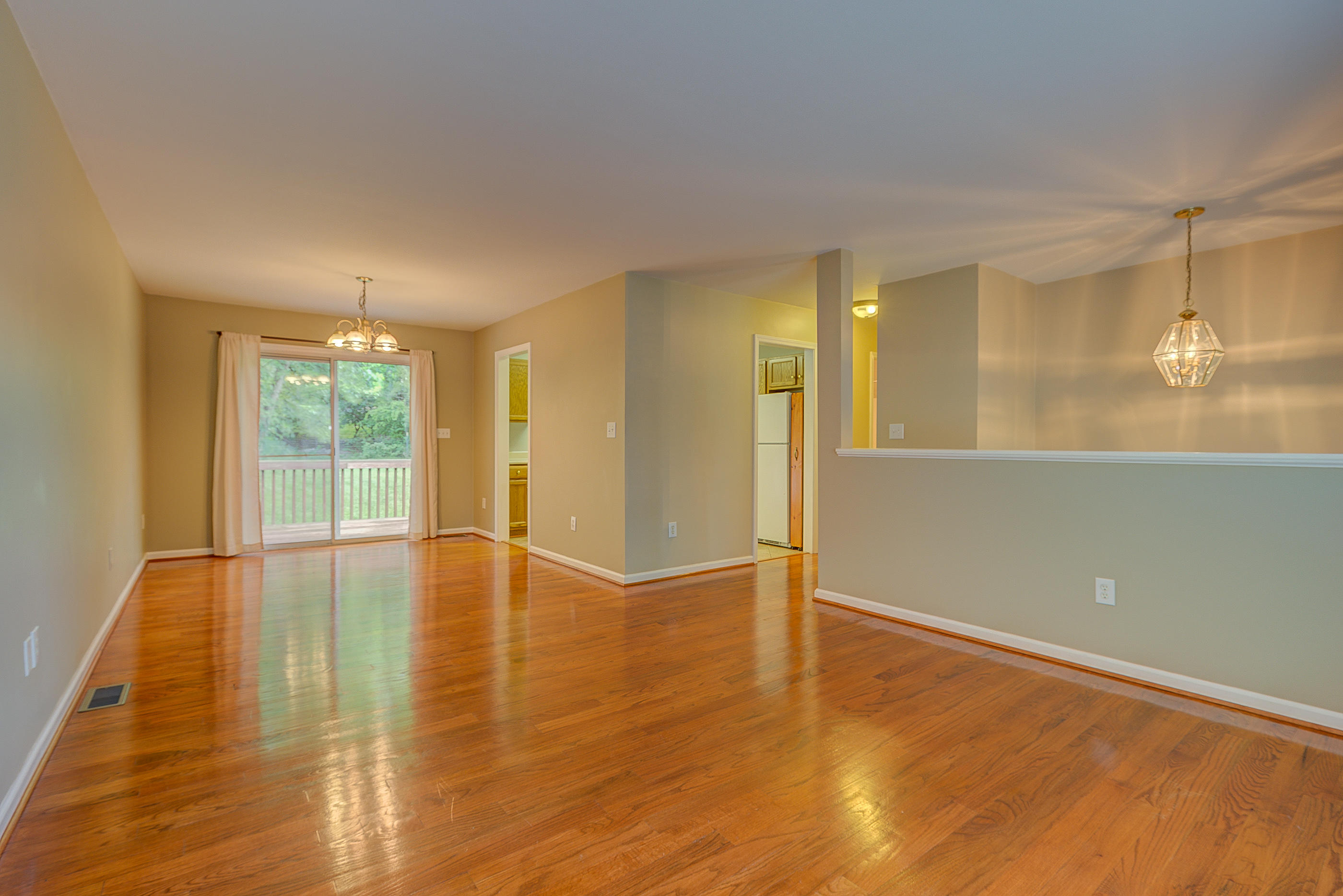 4431 Keefer Road Roanoke, VA 24018 - Photo 3 of 23 an empty room with wooden floor and windows