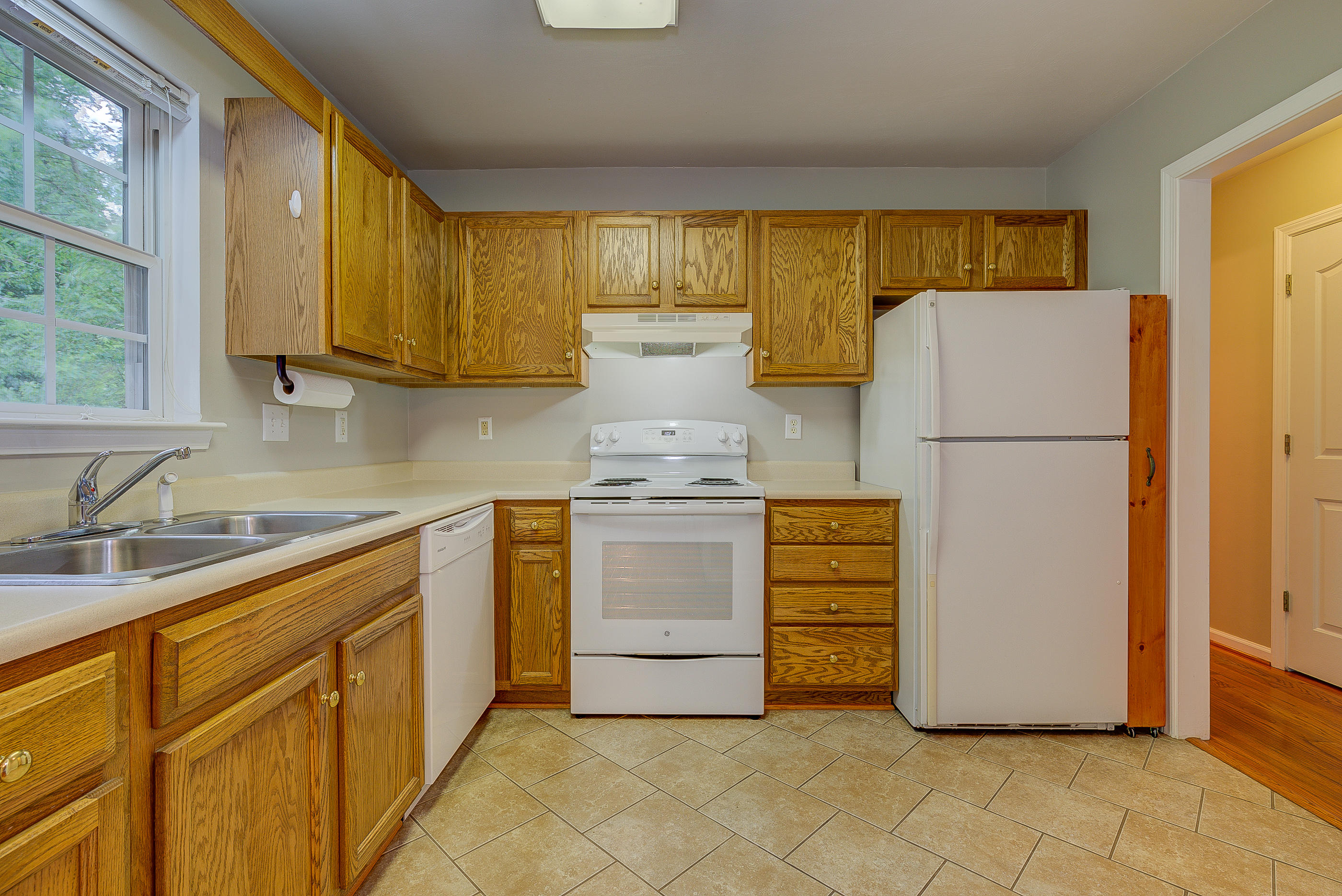 4431 Keefer Road Roanoke, VA 24018 - Photo 8 of 23 a kitchen with appliances cabinets and a sink
