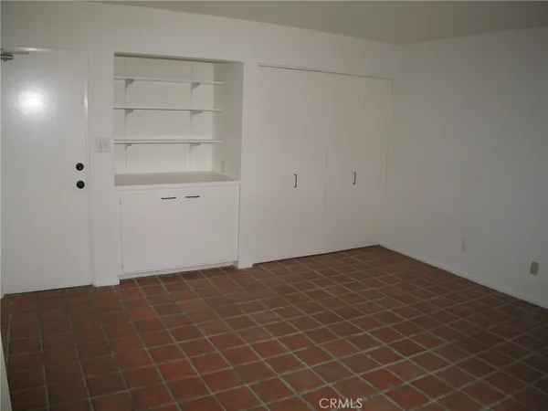 an empty room with cabinet
