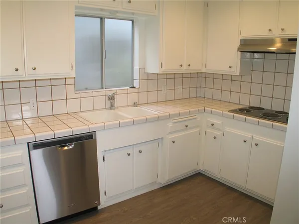 a utility room with a sink washer and dryer