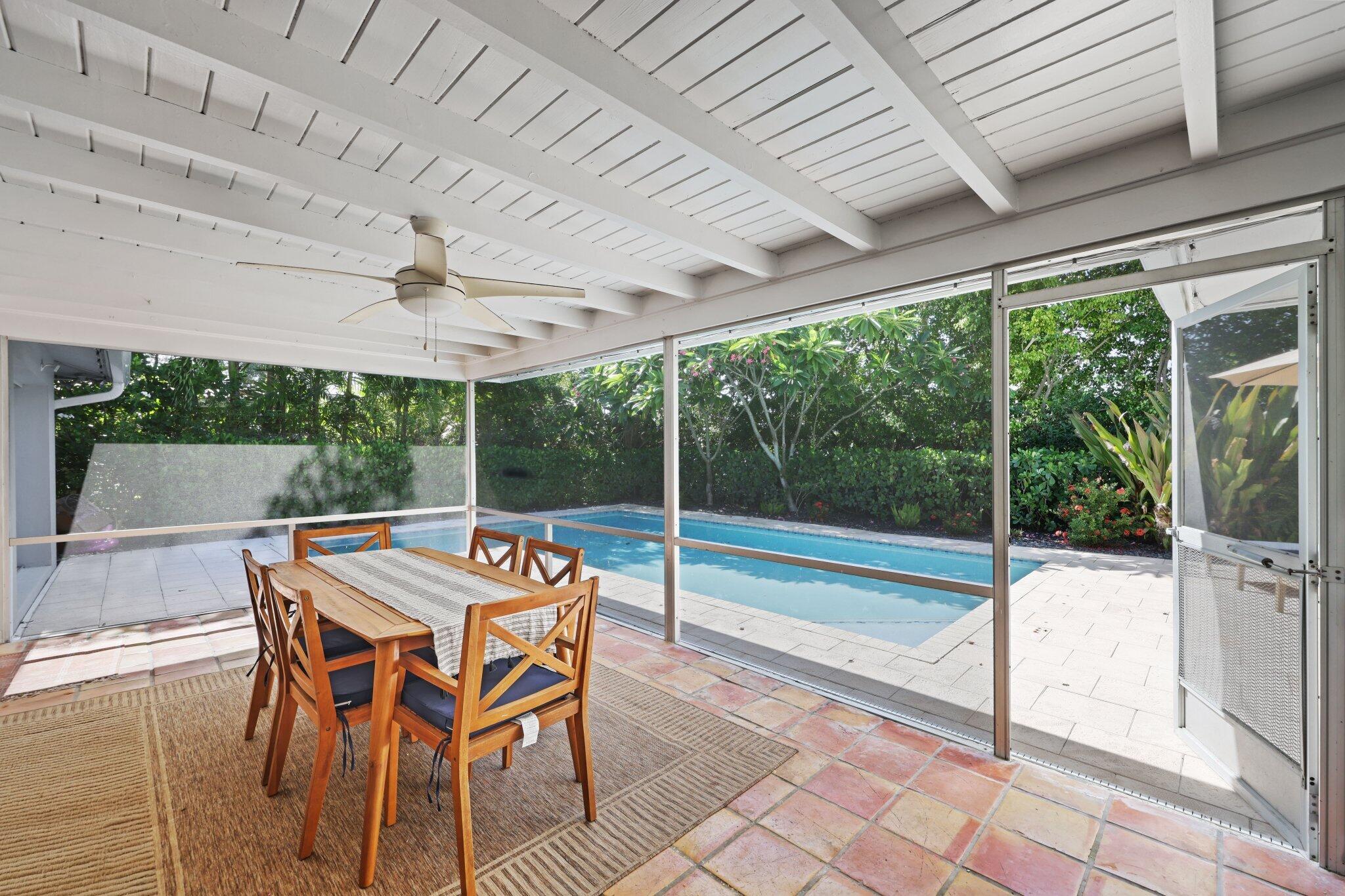 926 Southwest 1st Street Boca Raton, FL 33486 - Photo 35 of 60 a roof deck with table and chairs and wooden floor