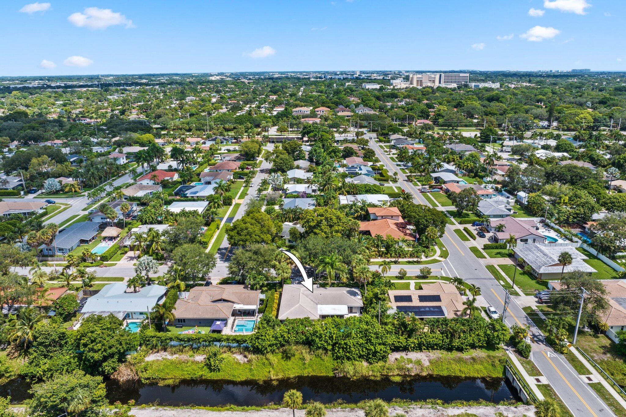 926 Southwest 1st Street Boca Raton, FL 33486 - Photo 54 of 60 an aerial view of residential houses with outdoor space and trees