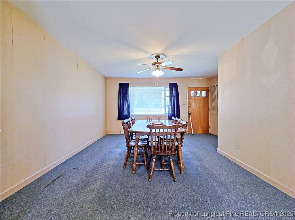 764 Old Vander Road Fayetteville, NC 28312 - Photo 5 of 50 a view of a dining room with furniture and a chandelier