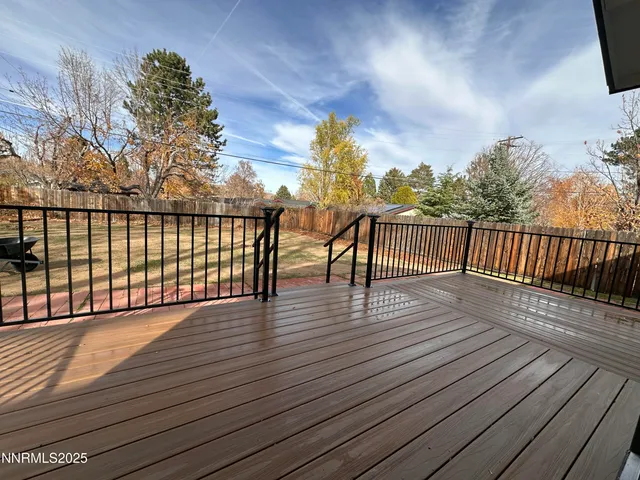 a view of deck with wooden floor and fence