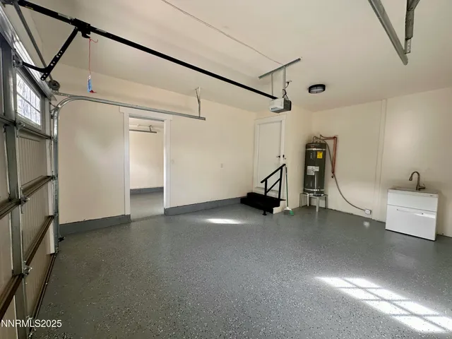 a view of a livingroom with furniture and a ceiling fan