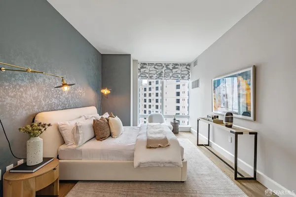 a bedroom with a bed and window