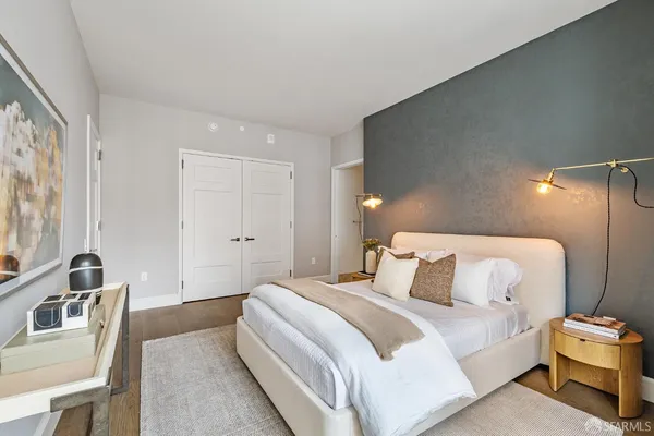 a bedroom with a bed and a couch