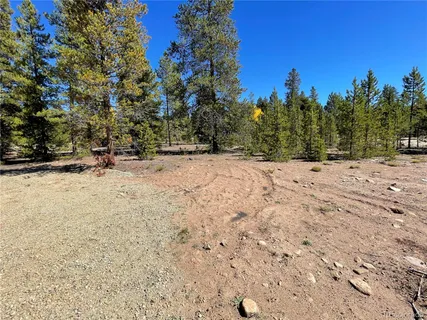 a view of wooden fence and trees