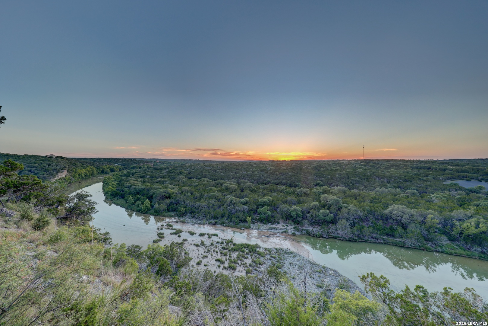 189 Cherry Springs Road Hunt, TX 78024 - Photo 2 of 34 a view of a lake with mountains in the background