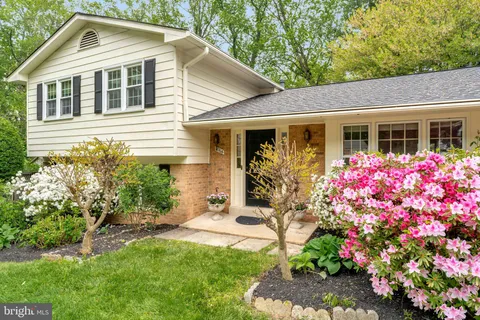 a front view of house with yard and outdoor seating