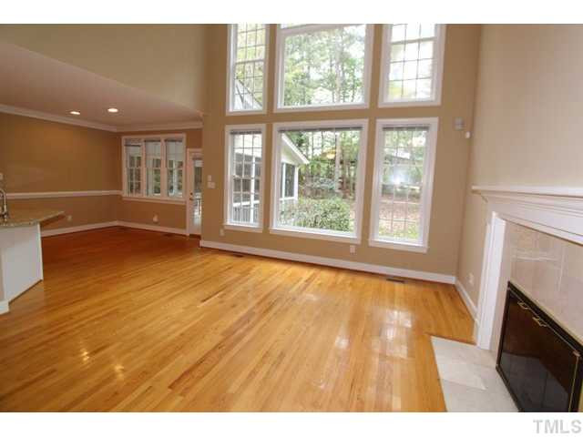 820 Nolstead Court Raleigh, NC 27614 - Photo 9 of 25 Soaring ceilings and double stacked windows bring in lots of natural light. Fireplace is great for those cozy fall/winter nights. Den/Family/Great Room