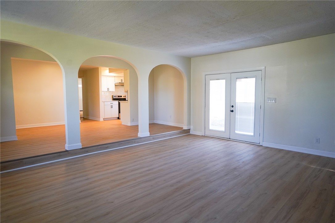 8746 Grubbs-Rex Road Arcanum, OH 45304 - Photo 17 of 38 This bright interior features arched doorways, creating an inviting and open flow between rooms.