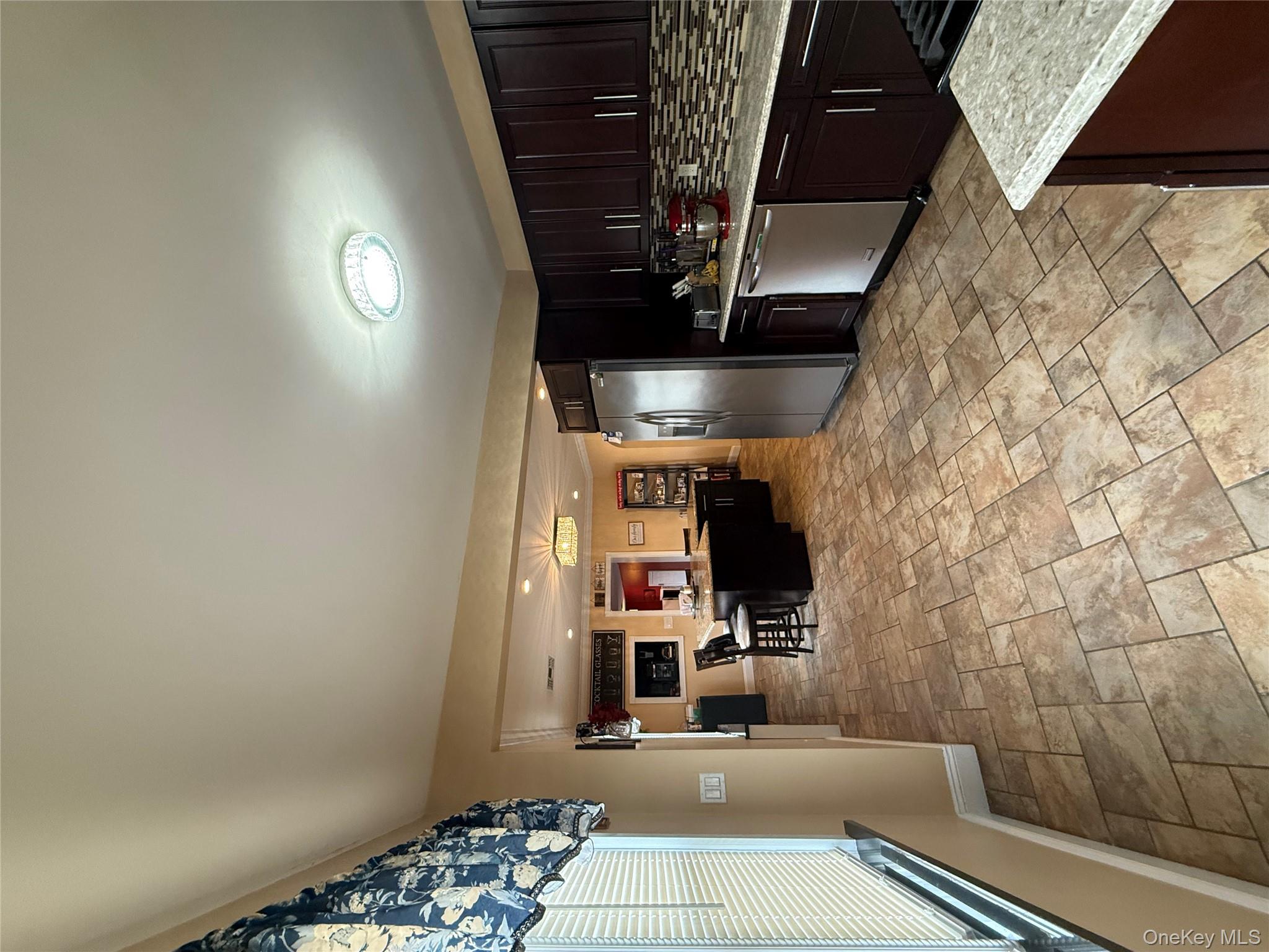 57 Laurel Road Lindenhurst, NY 11757 - Photo 11 of 24 a kitchen with stainless steel appliances granite countertop a sink counter space and cabinets