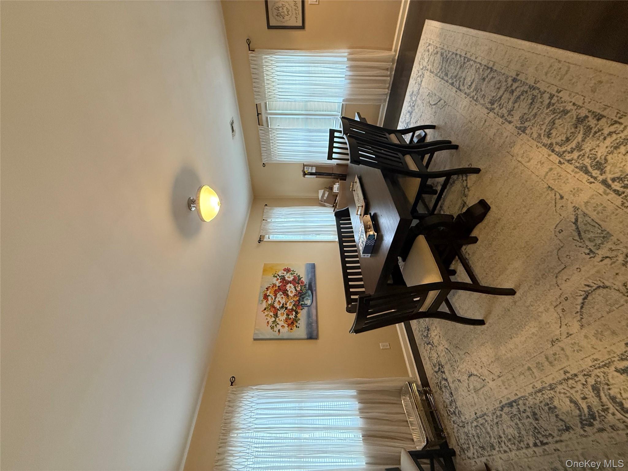 57 Laurel Road Lindenhurst, NY 11757 - Photo 13 of 24 a dining room with furniture and window