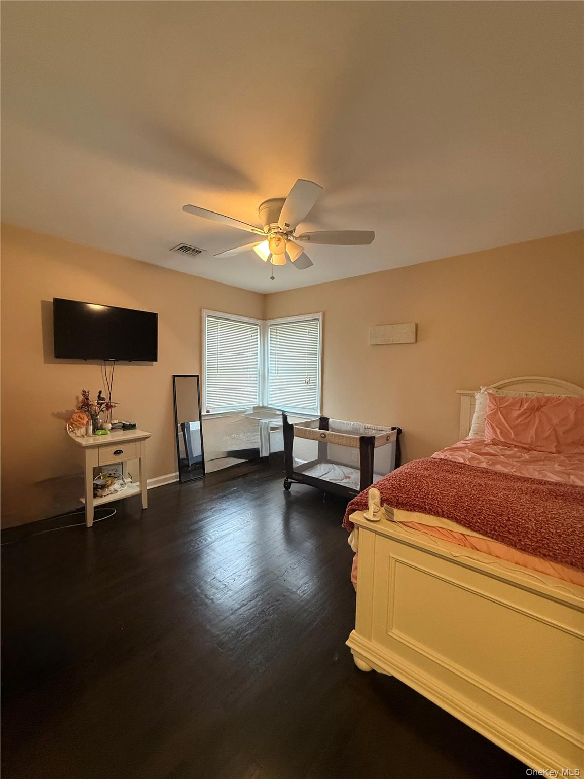 57 Laurel Road Lindenhurst, NY 11757 - Photo 17 of 24 a living room with furniture and a flat screen tv