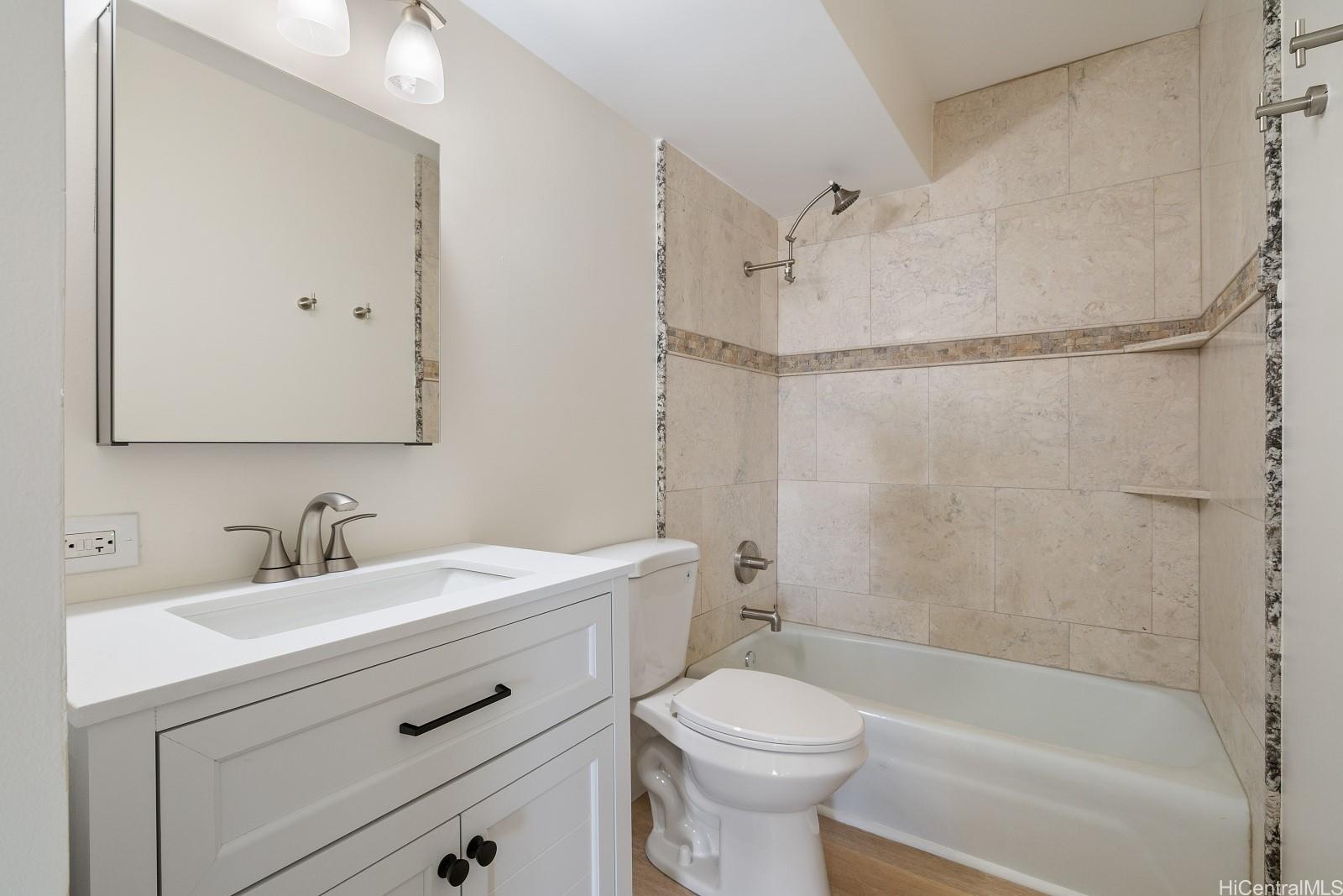 1516 Ward Avenue, Unit 302 Honolulu, HI 96822 - Photo 10 of 16 Well appointed bathroom with new vanity, flooring, toilet and cultured shower with tub