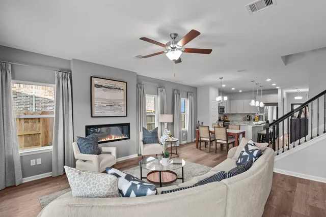 a living room with furniture and a window