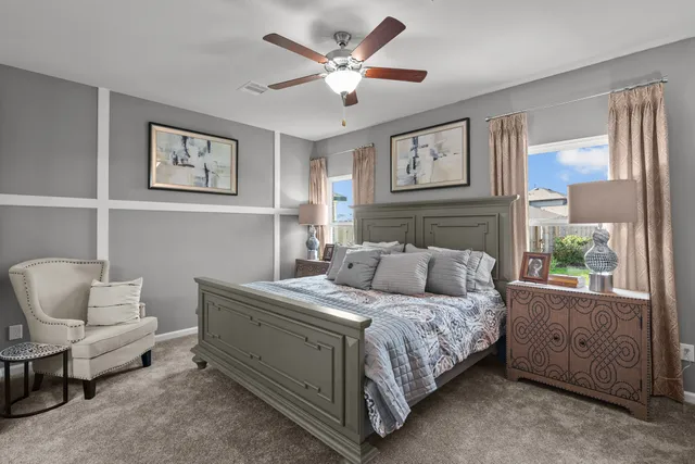 a bedroom with a bed and a couch