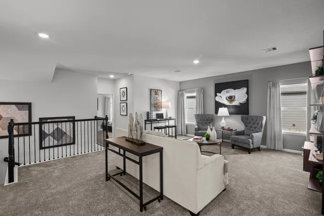 a living room with furniture and a table