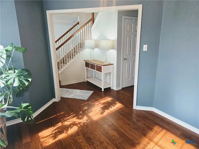 a view of entryway with wooden floor