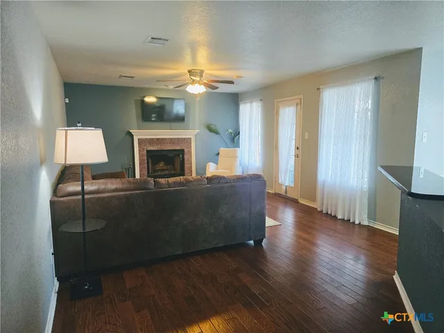 a living room with furniture and a fireplace