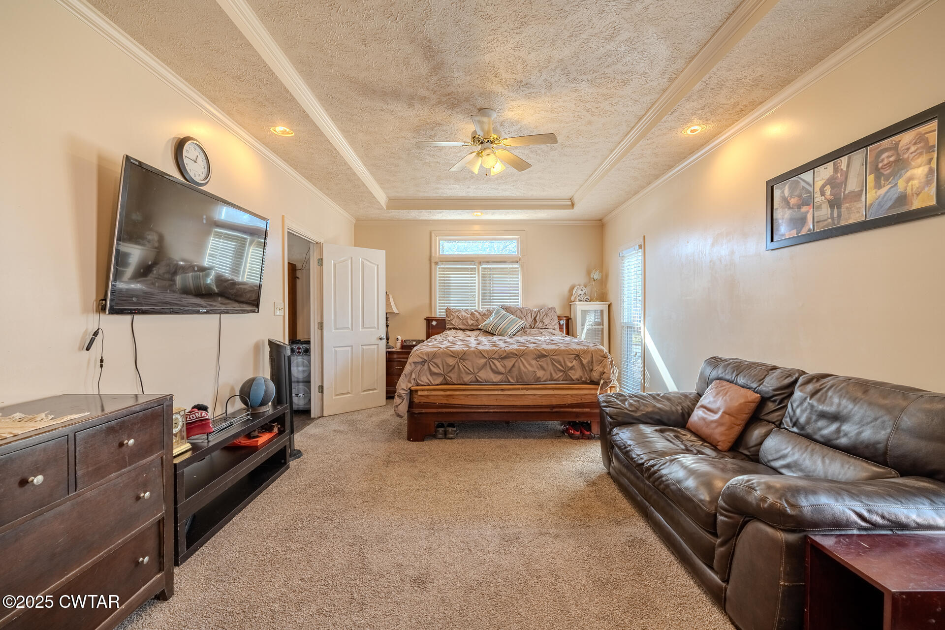 43 Paddock Place Jackson, TN 38305 - Photo 13 of 38 a bedroom with furniture and a flat screen tv