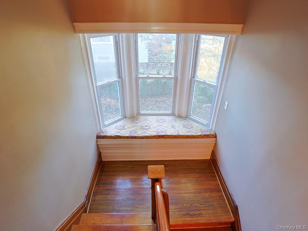 113 Hooker Avenue Poughkeepsie, NY 12601 - Photo 12 of 49 Stairway featuring healthy amount of natural light and wood-type flooring