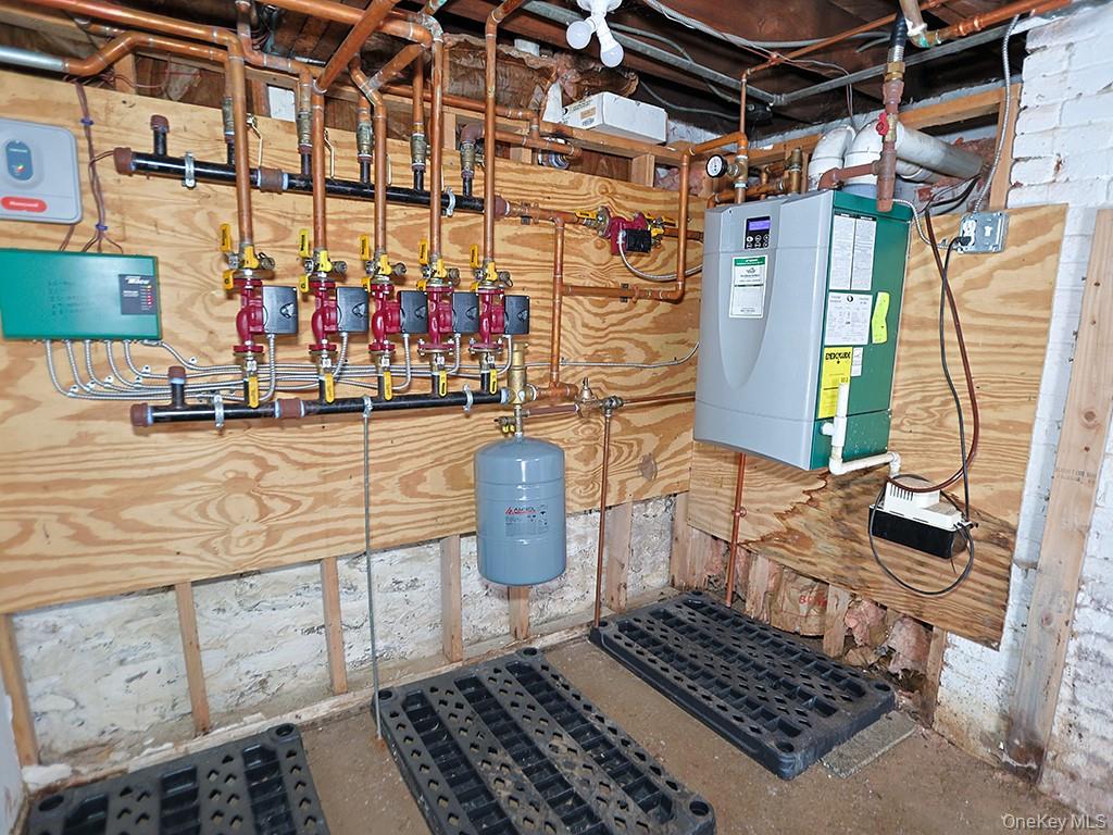 113 Hooker Avenue Poughkeepsie, NY 12601 - Photo 36 of 49 Utility room with a heating unit