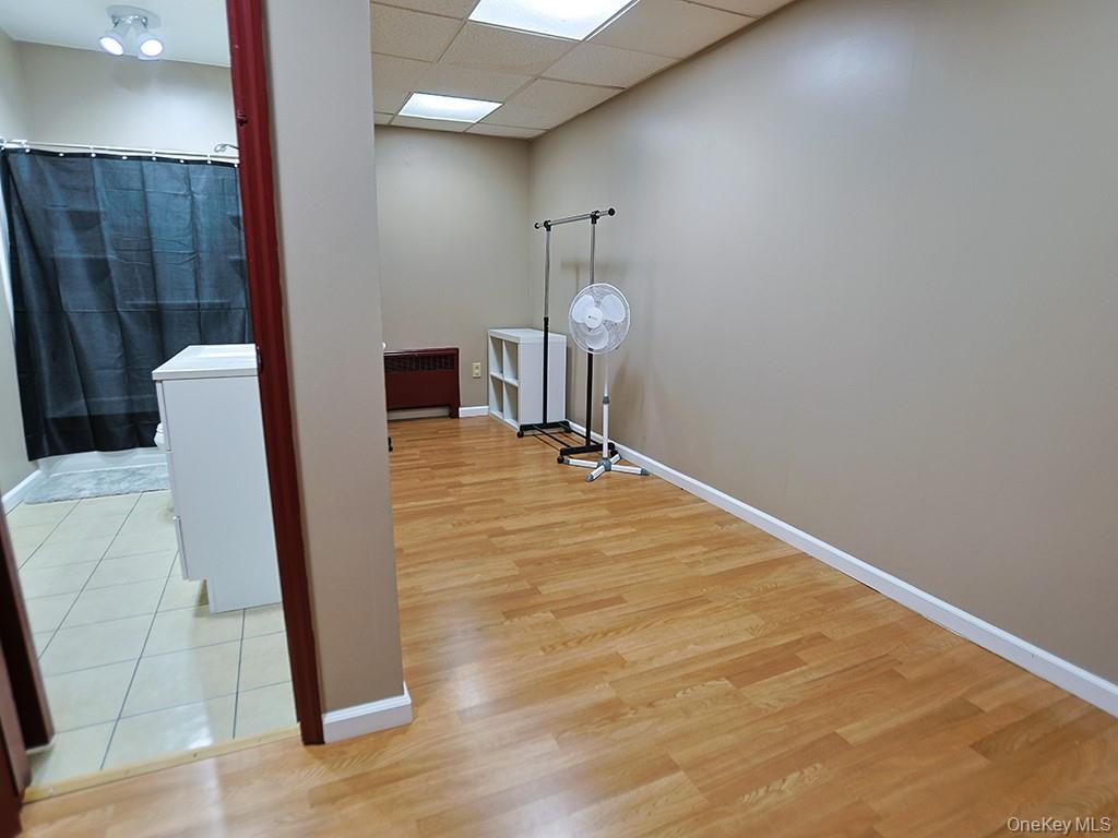 113 Hooker Avenue Poughkeepsie, NY 12601 - Photo 47 of 49 Corridor with a paneled ceiling and light wood-style flooring